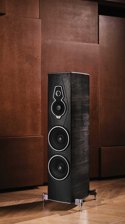 Sonus faber Amati G5 floorstanding speaker in Graphite Wood finish, displaying its elegant design in a warm environment.