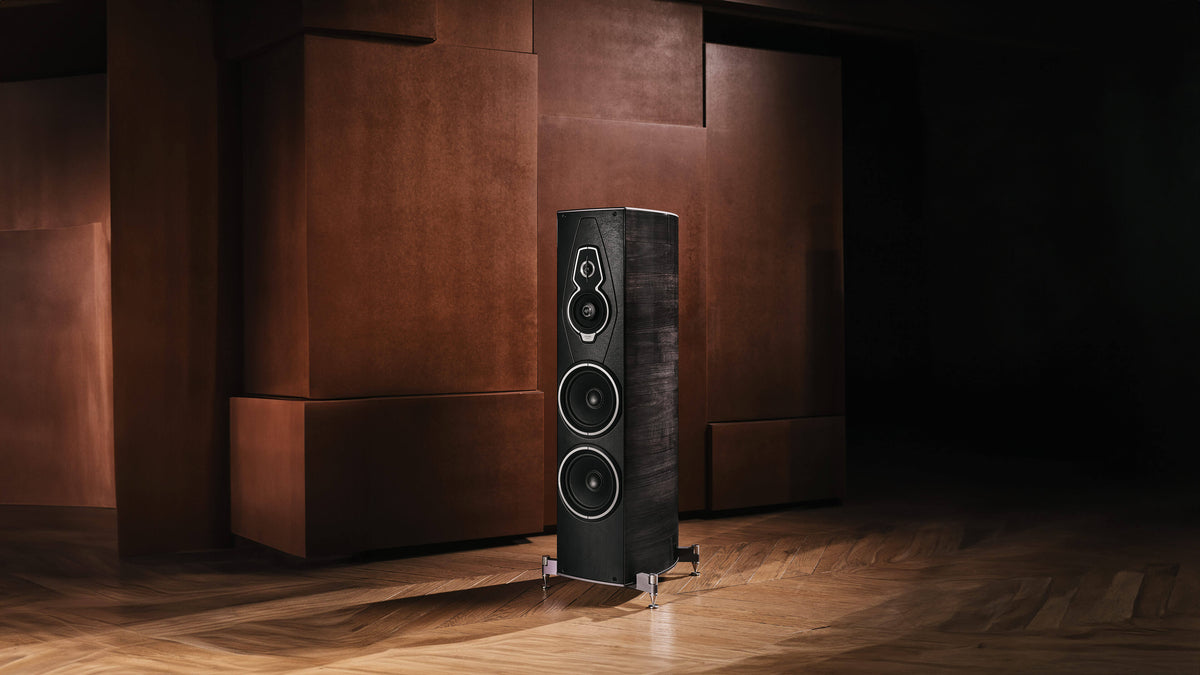Sonus faber Amati G5 floorstanding speaker in Graphite Wood finish, displaying its elegant design in a warm environment.
