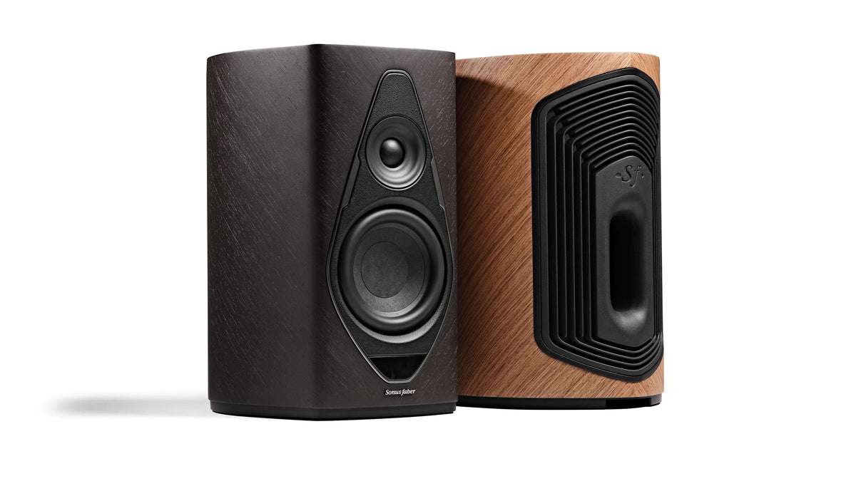 Duetto wireless speakers with front and back designs, featuring walnut and graphite wood and black leather finishes.