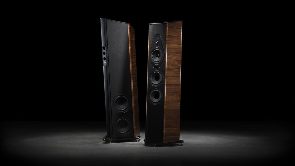 A pair of Sonus faber Il Cremonese floorstanding loudspeakers in Walnut high gloss wood with black inlays and black leather.