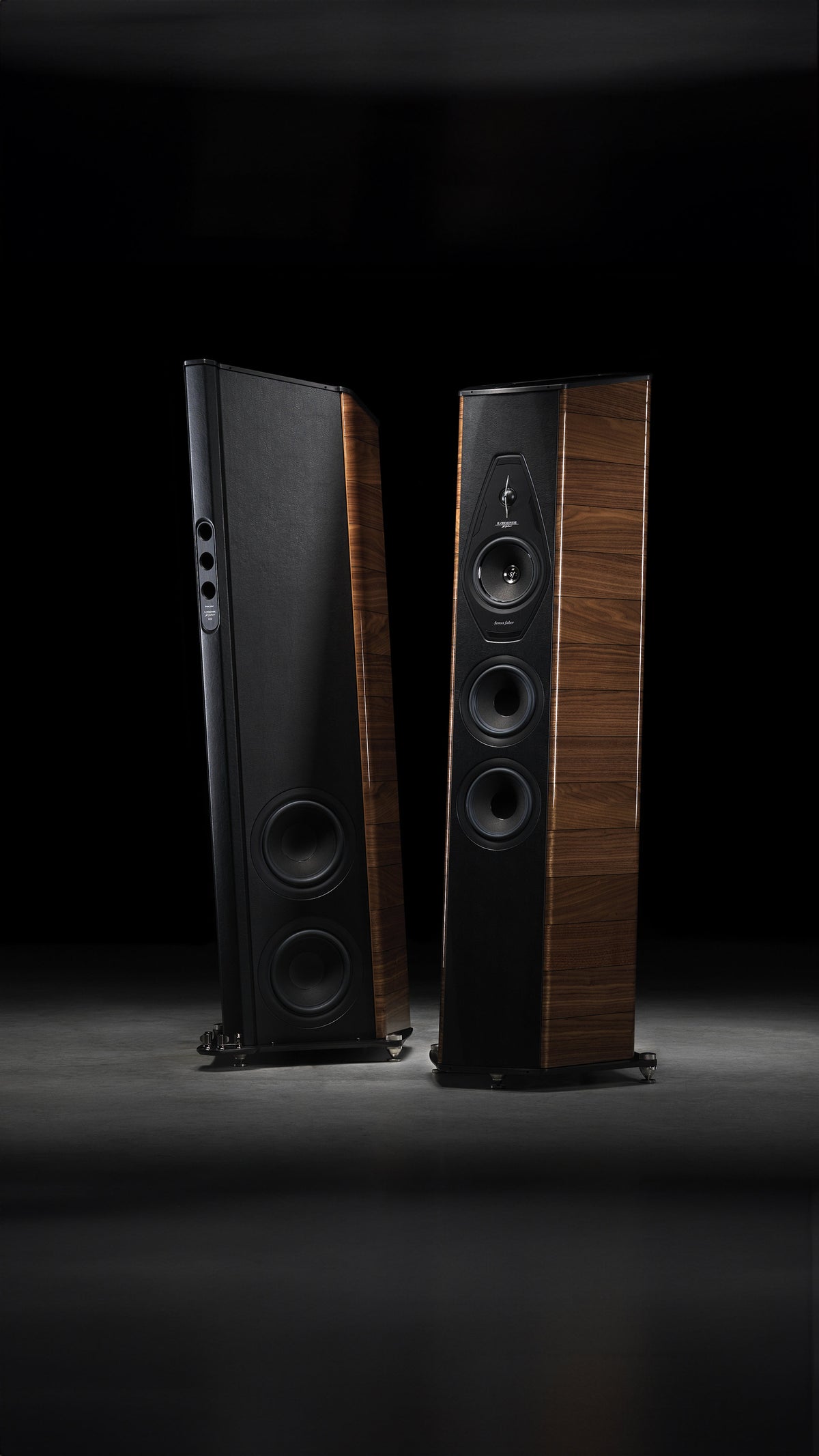 A pair of Sonus faber Il Cremonese floorstanding loudspeakers in Walnut high gloss wood with black inlays and black leather.