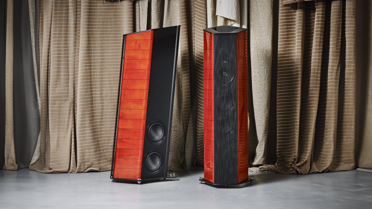 A pair of Sonus faber Il Cremonese Ex3me speakers showcasing the front and back sides in Red Violin high gloss wood.