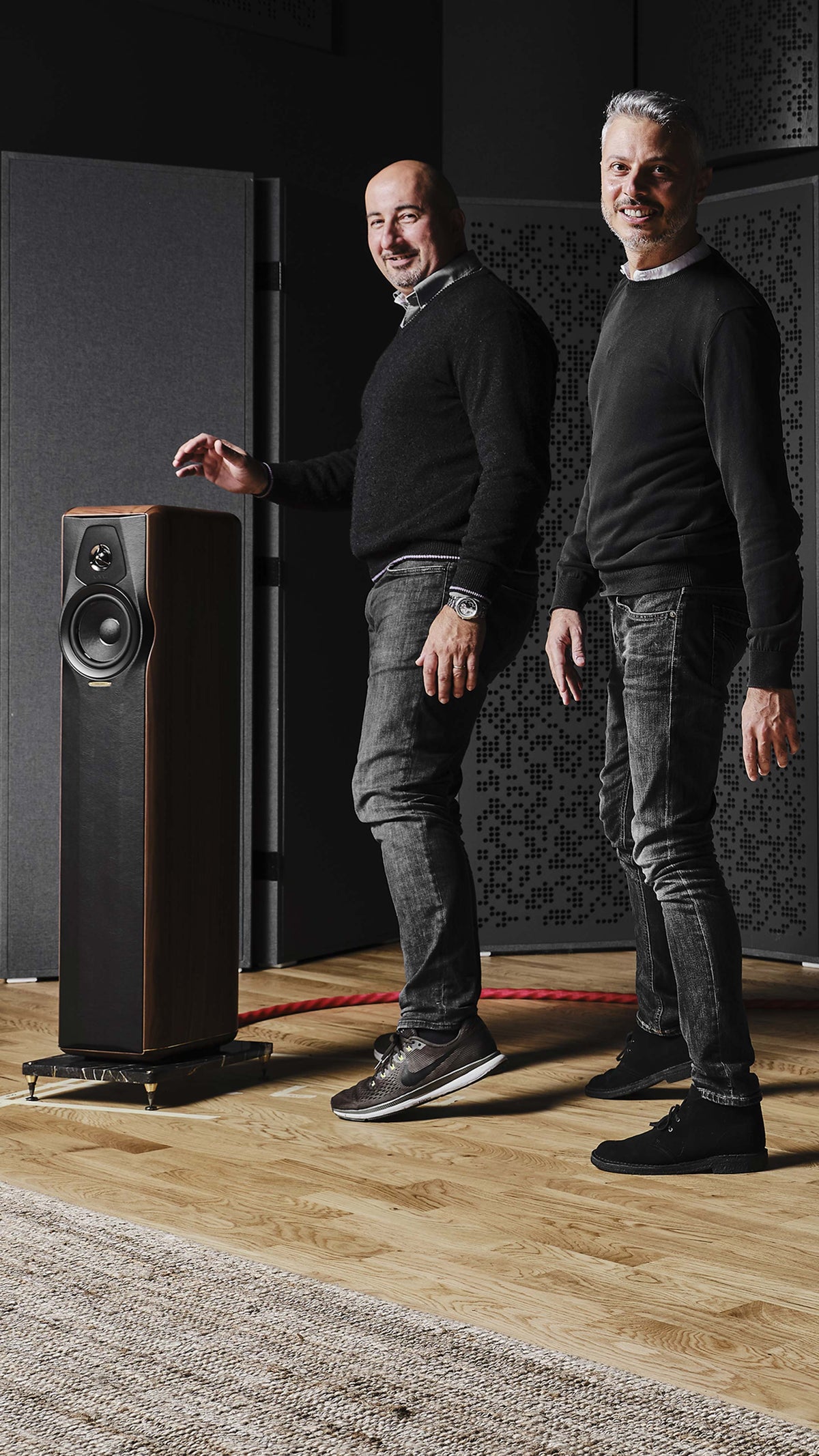 Group of people listening to the Sonus faber Maxima Amator floorstanding loudspeakers at the Sonus faber Design Lab.