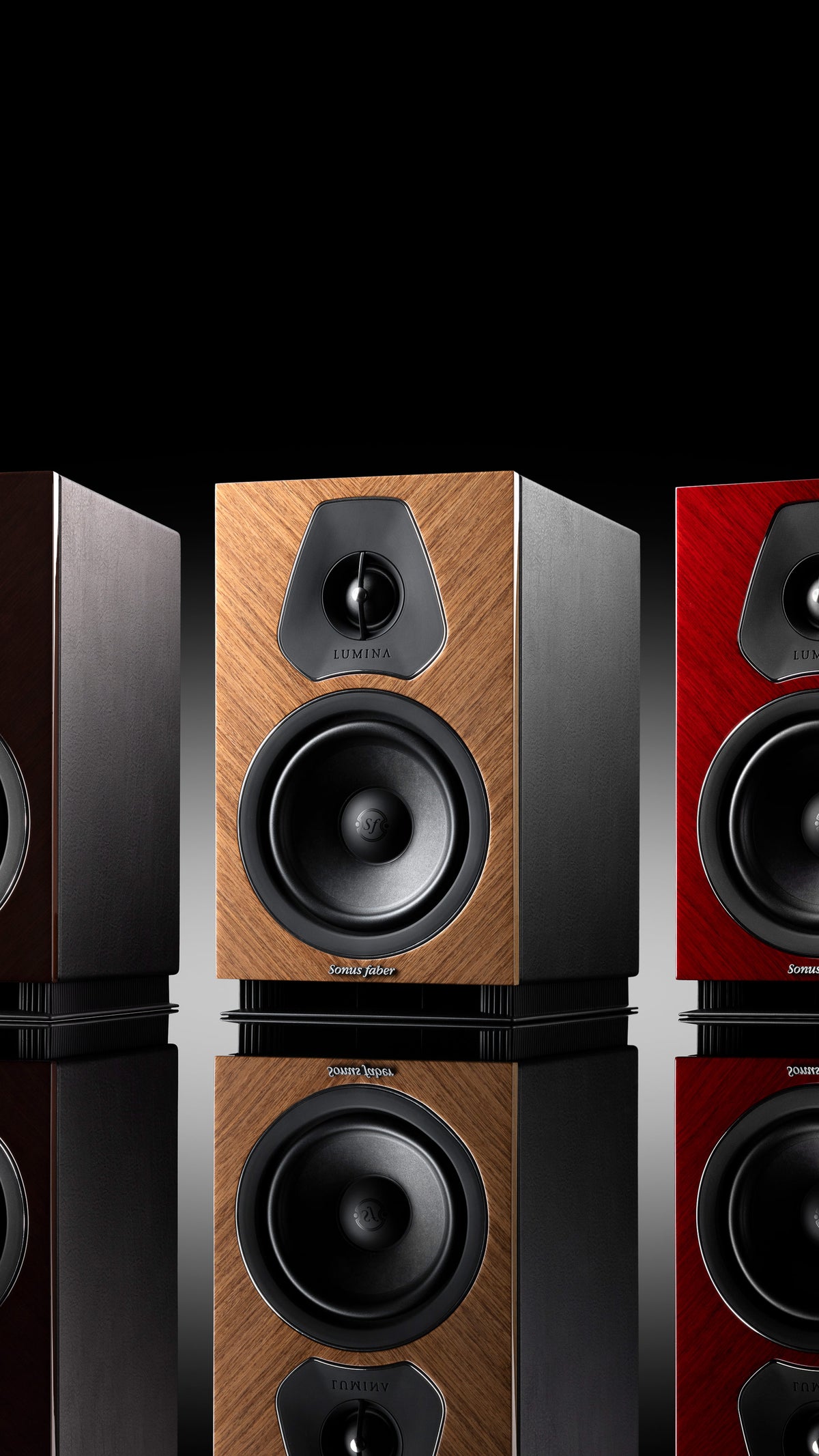 A trio of Sonus faber Lumina II Amator speakers, available in red, wenge, and walnut high gloss finishes