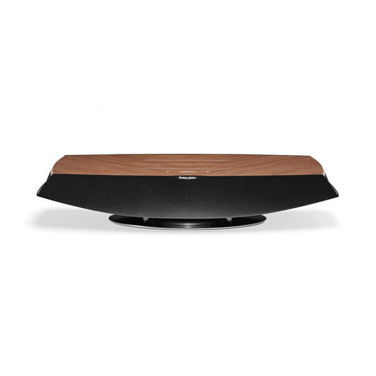 A front view of the Sonus faber Omnia wireless bookshelf speaker in walnut wood finish.