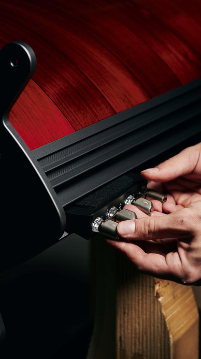Sonus faber craftsman showcases the discreet port system on a Serafino G2 floorstanding speaker, cleverly hidden for a sleek aesthetic.